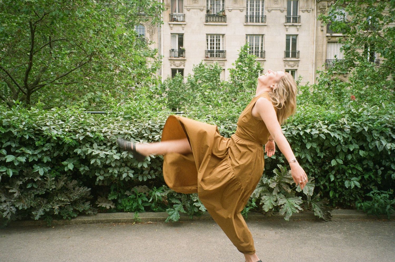 destination portrait photography in Paris park with cinematic film aesthetic and soft, romantic tones
