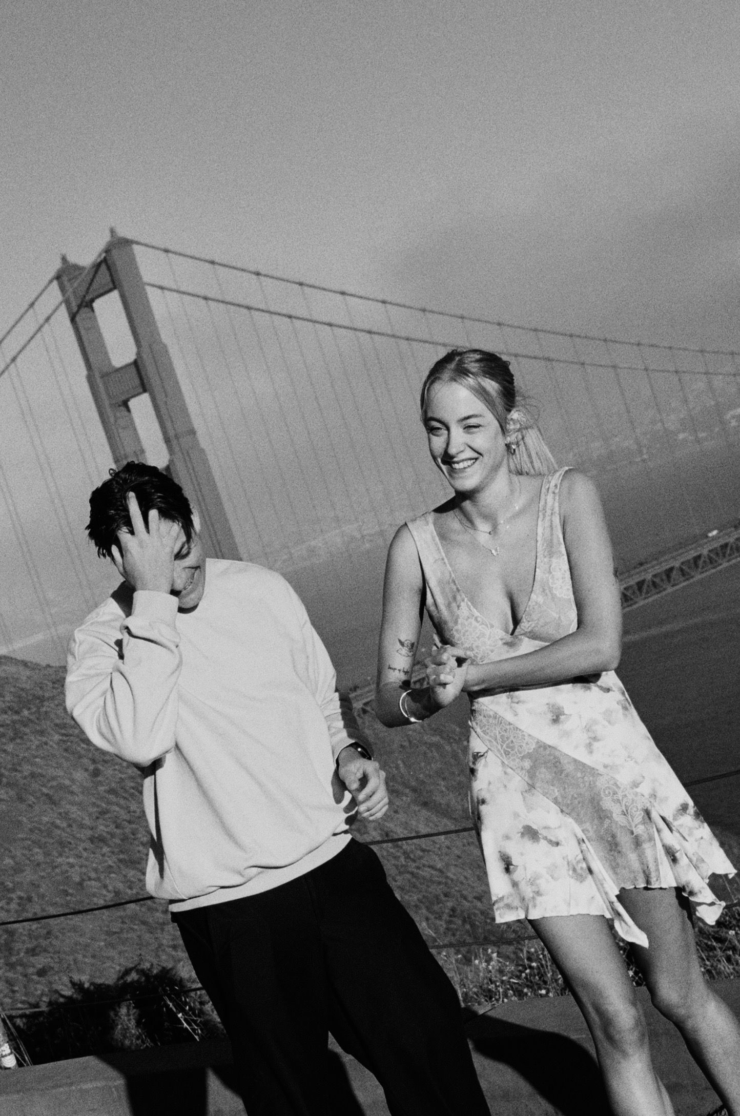 San Francisco engagement photos at the Golden Gate Bridge featuring a stylish couple photographed on film