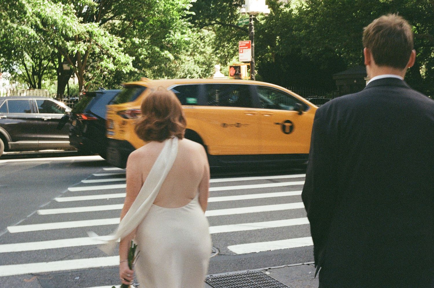 Newlywed couple walking through Manhattan after a courthouse elopement with cinematic 35mm film photography