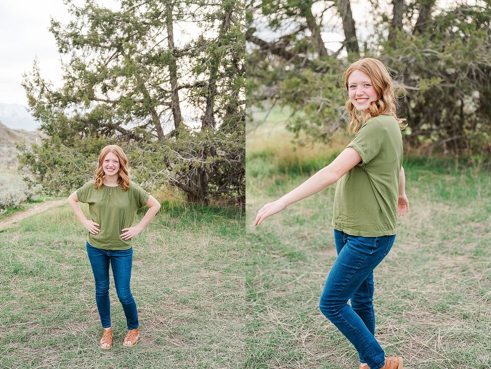 Playful outdoor photo session in green shirt and jeans against natural landscape.