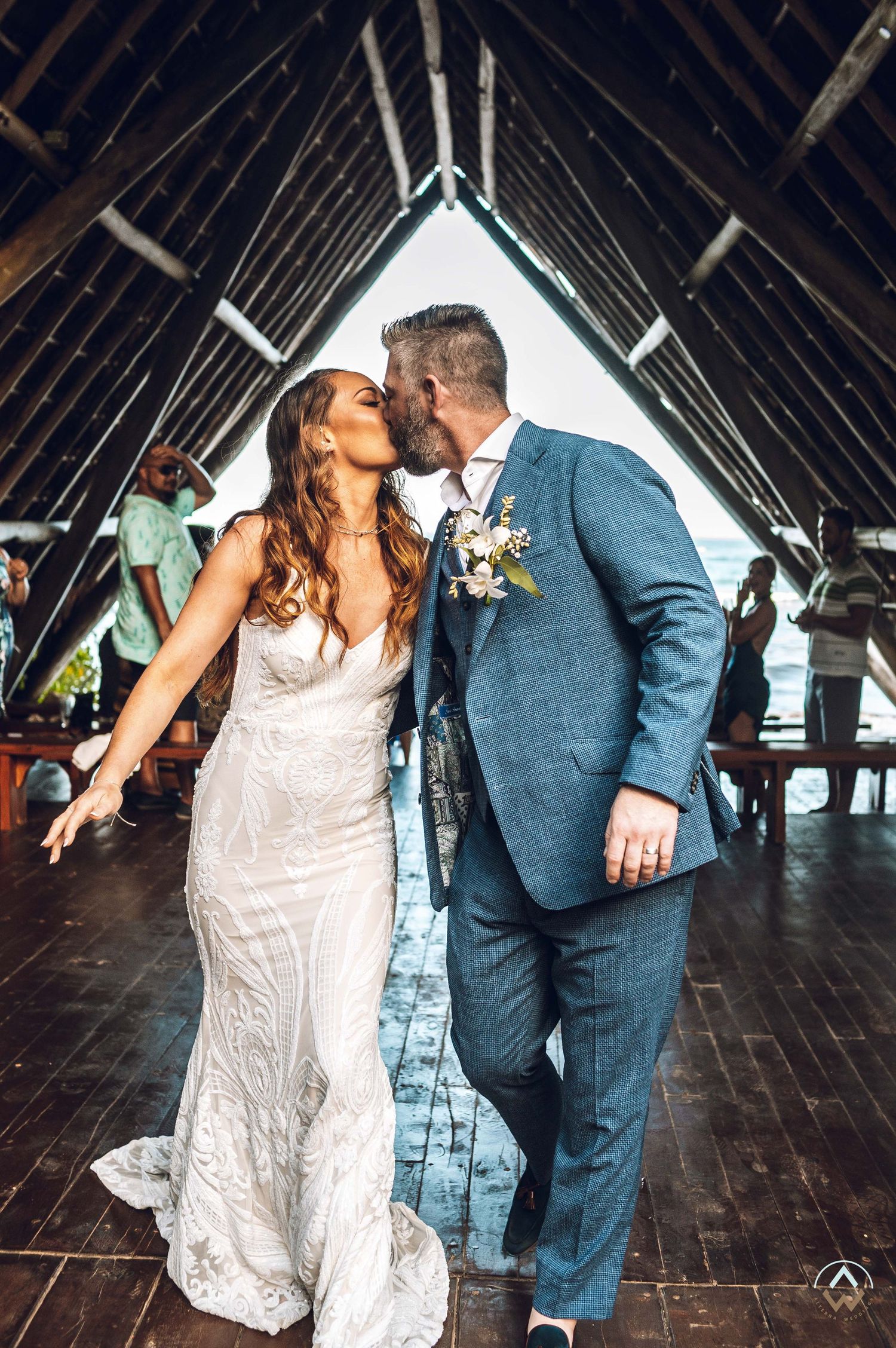 First dance in rustic wooden venue with dramatic angular ceiling and natural lighting, Papaya Playa Tulum Wedding.