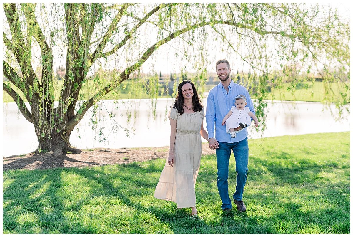 Family walking under tree in Coxhall Gardens Family Portrait Session