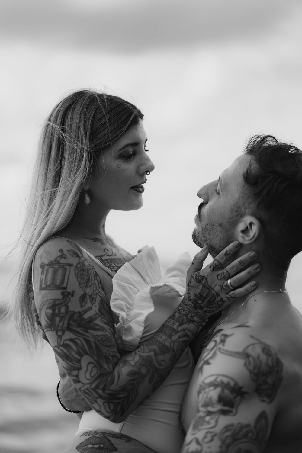 A romantic black and white photo series showing an intimate couple embracing in various tender poses.