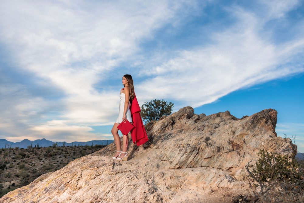 Tucson, AZ senior girl in the desert with blue sky's with a beautiful sunset on big rocks