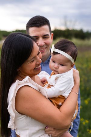 Intimate family moment captured outdoors with soft lighting.