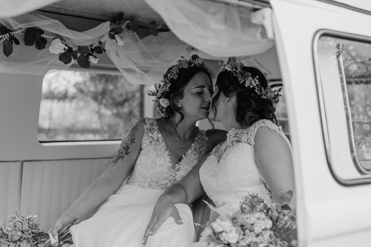 A vintage van interior decorated with floral garlands in black and white.