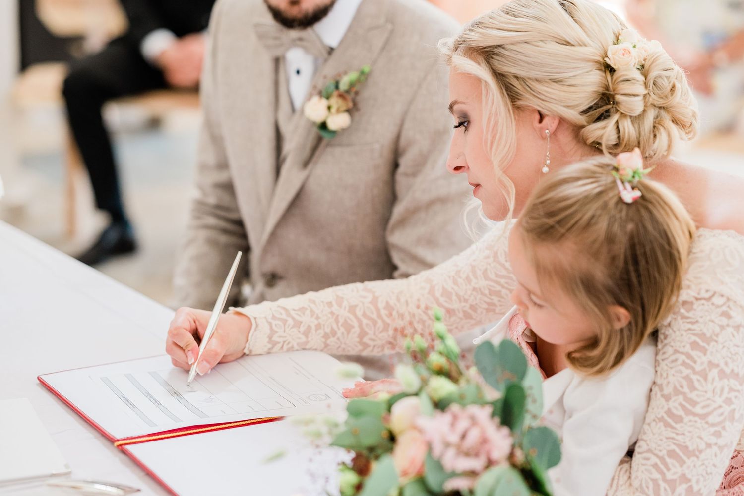 Bride signing marriage certificate in Switzerland