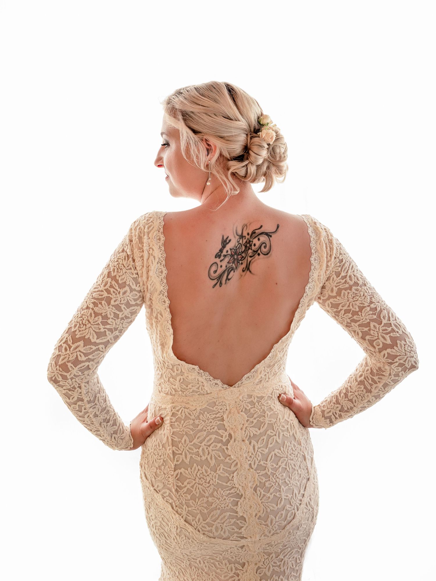Bride, showing her beautiful dress from the back in Nyon, Switzerland