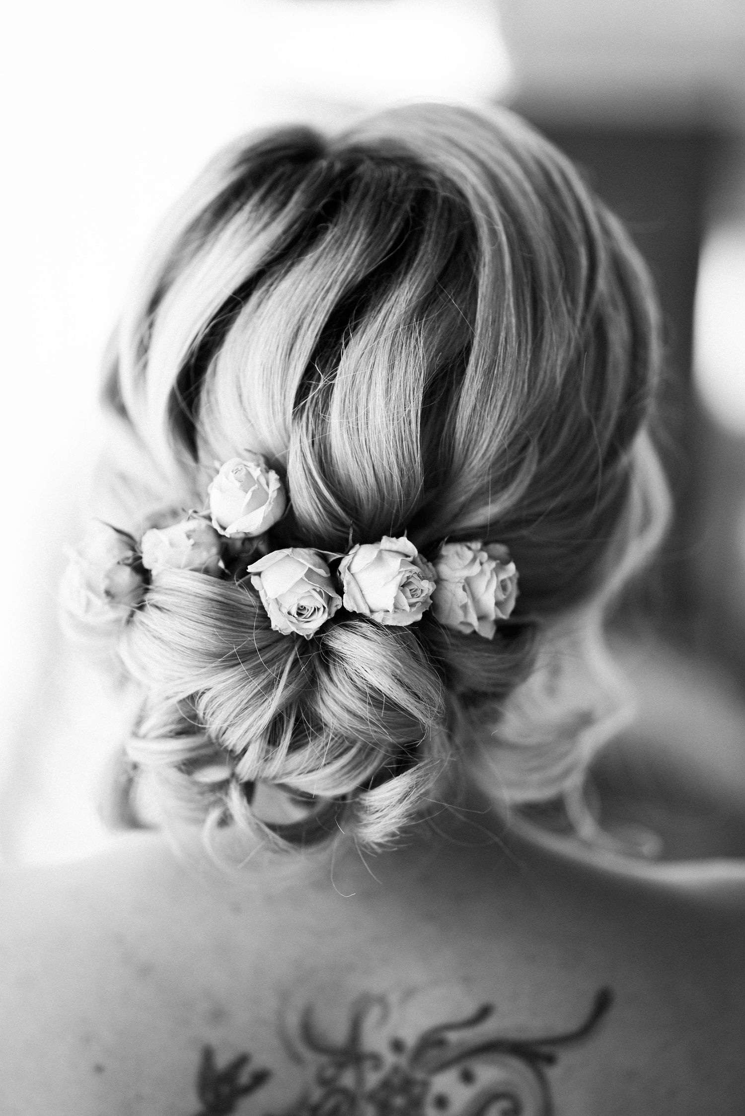 Bride, showing her beautiful hairstlye from the back in Nyon, Switzerland
