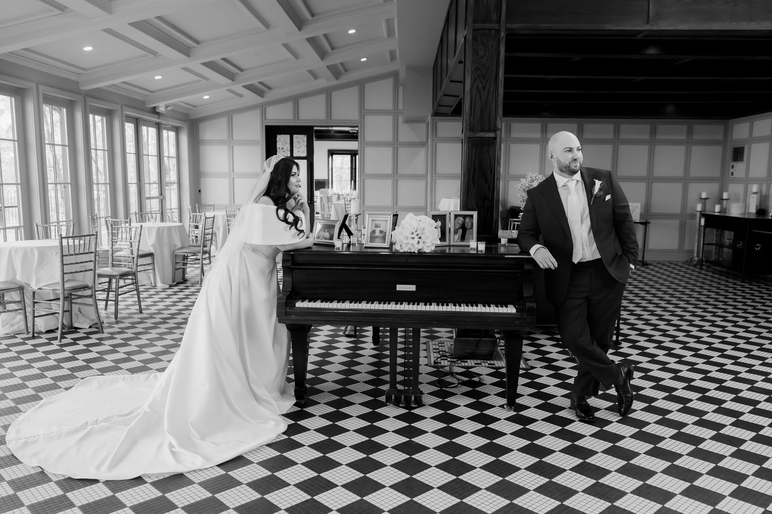 Black and white wedding portraits on cobblestone street with classic architecture.