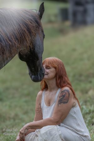 Artistic portrait capturing close connection between horse and person in white dress. Sonya Helm Equine Photography, Bristol, TN