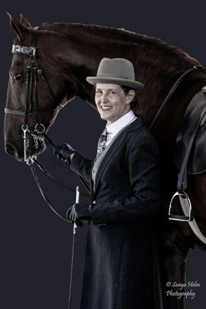 Formal equestrian portrait with a bay horse against dramatic black background. Sonya Helm Equine Photography, Bristol, TN