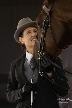 Dramatic side profile of an equestrian in vintage attire with their horse. Sonya Helm Equine Photography, Bristol, TN