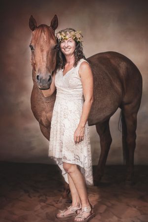 A little horse miniature pony appears in studio portraits alongside someone wearing a white lace dress and floral crown.