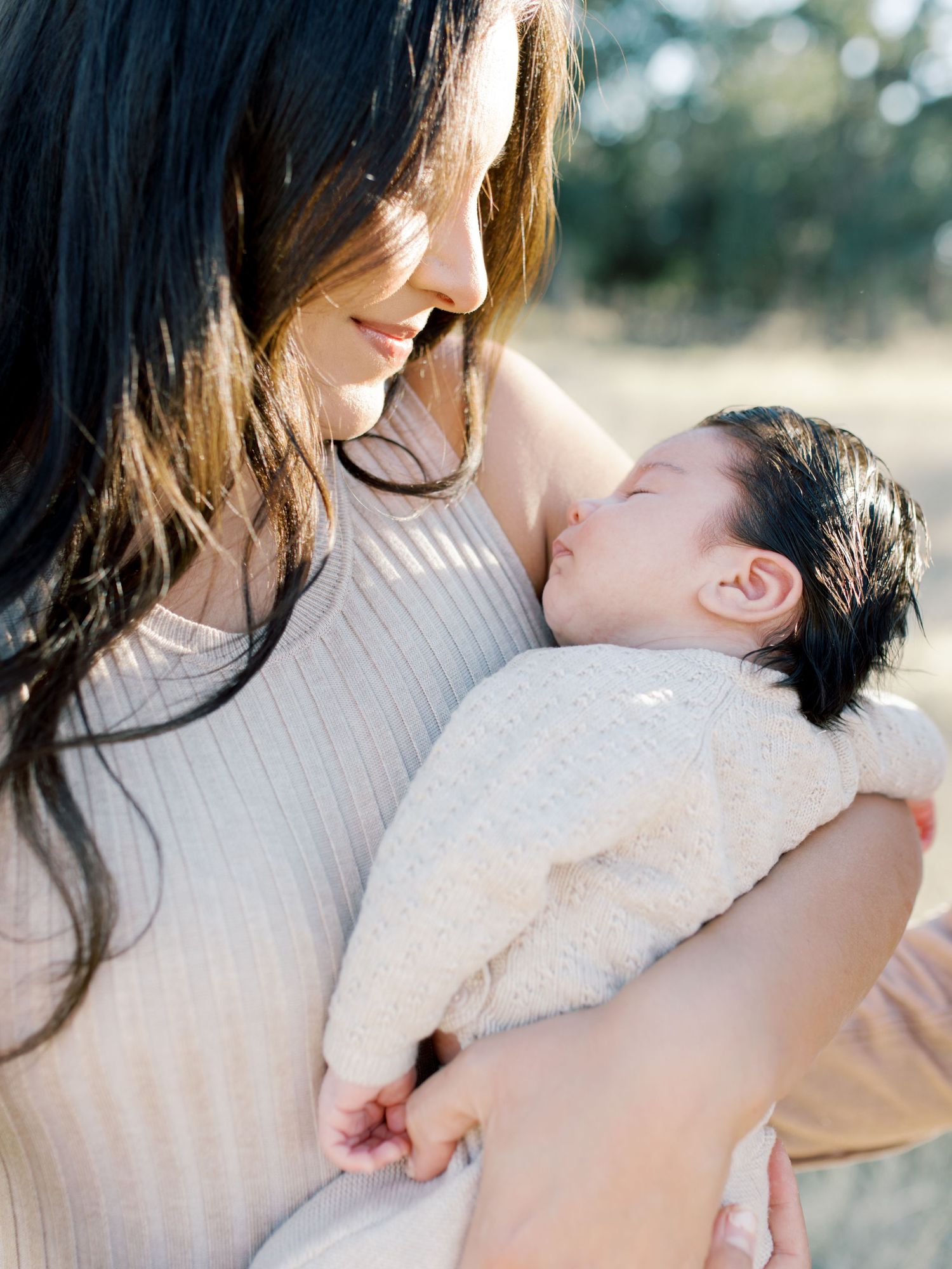 Tender moment between a mother and newborn son during a lifestyle newborn session with Kaitlin Stoltenberg in Chico. Chico, CA Photographer