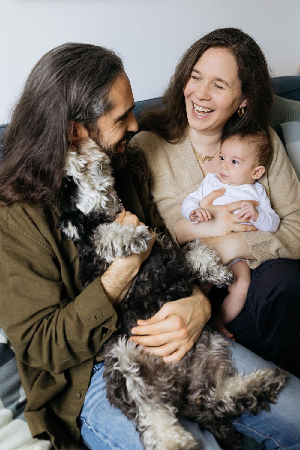 photo session at home in walthamstow with mum dad 2 month old baby and dog