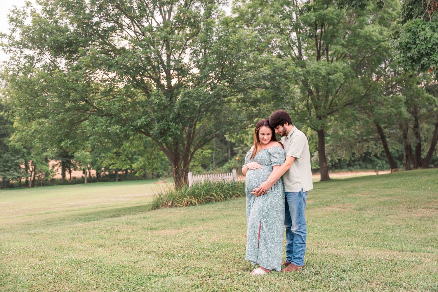 A couple taking maternity portraits at Ivy Manor Bed and Breakfast in Princeton, Kentucky.