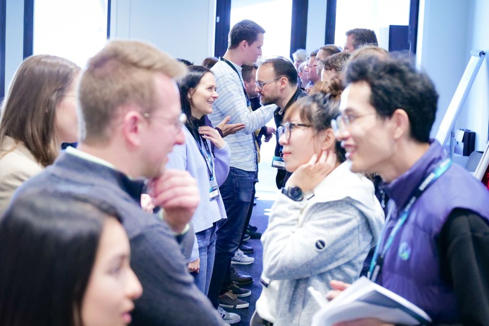 Diverse group of professionals networking and engaging at a business conference.