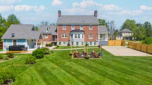 Bird's eye view of suburban development showing houses and green spaces.