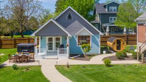 Panoramic view of suburban homes with neatly landscaped yards and driveways.