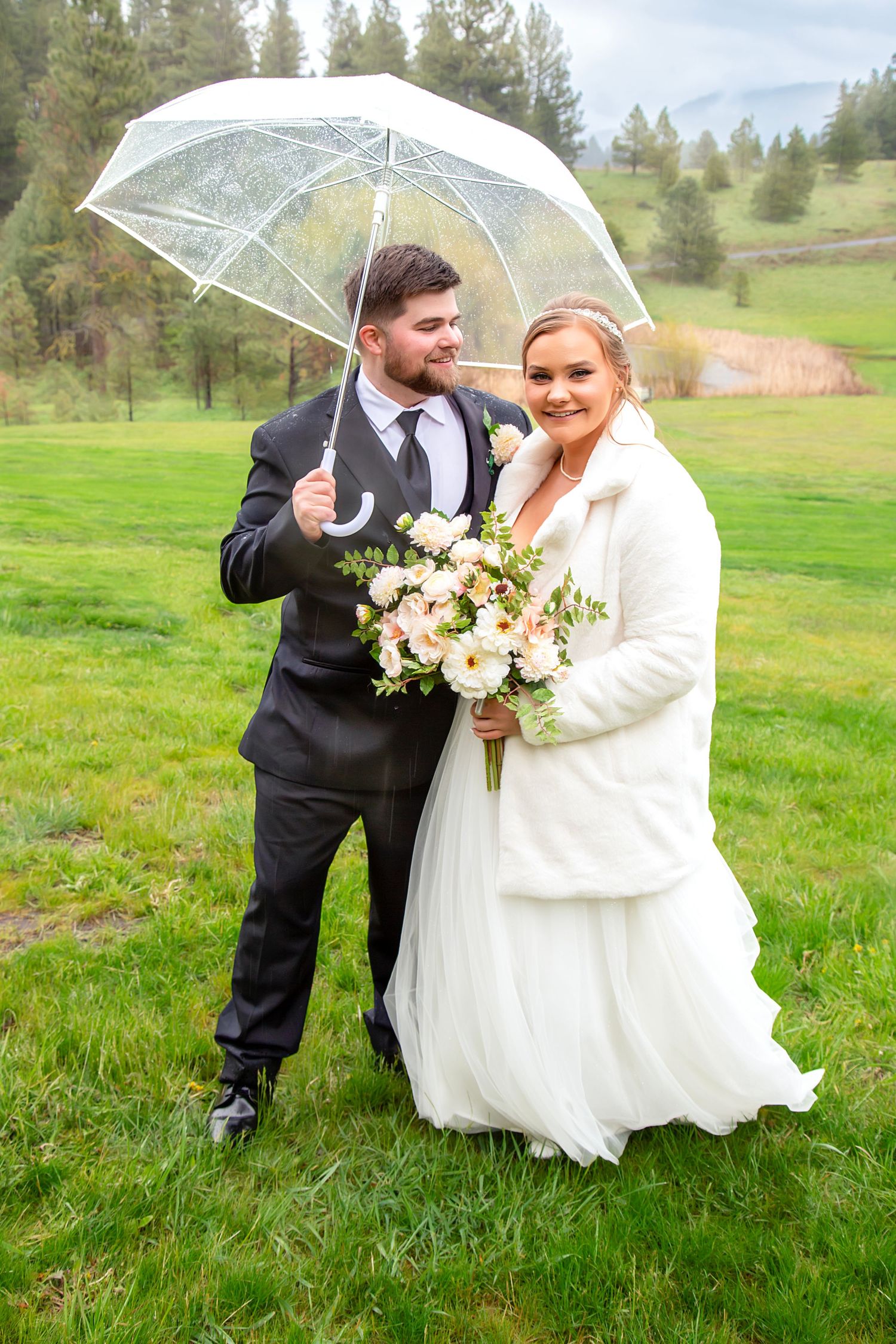 Bride and groom posing at their wedding at Swauk-Teanaway Grange wedding photography Cle Elum, Washington
