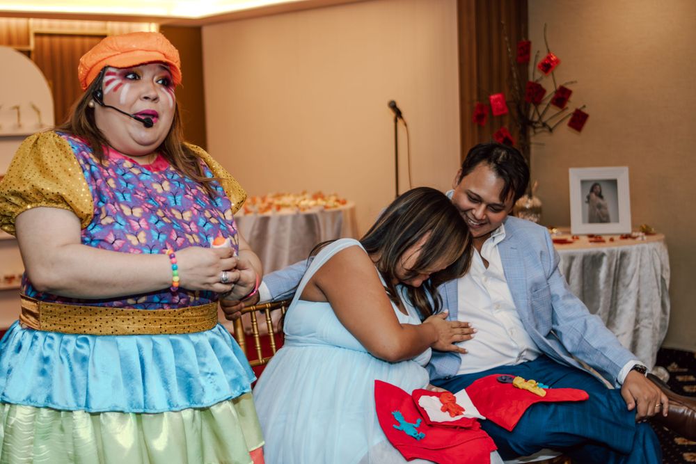 An entertainer in colorful costume brings laughter to a celebration.