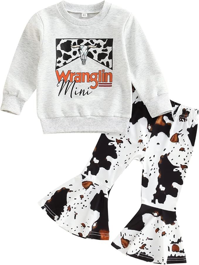Girls western-style outfit with grey sweater featuring cow pattern and matching cow print bell bottom pants.