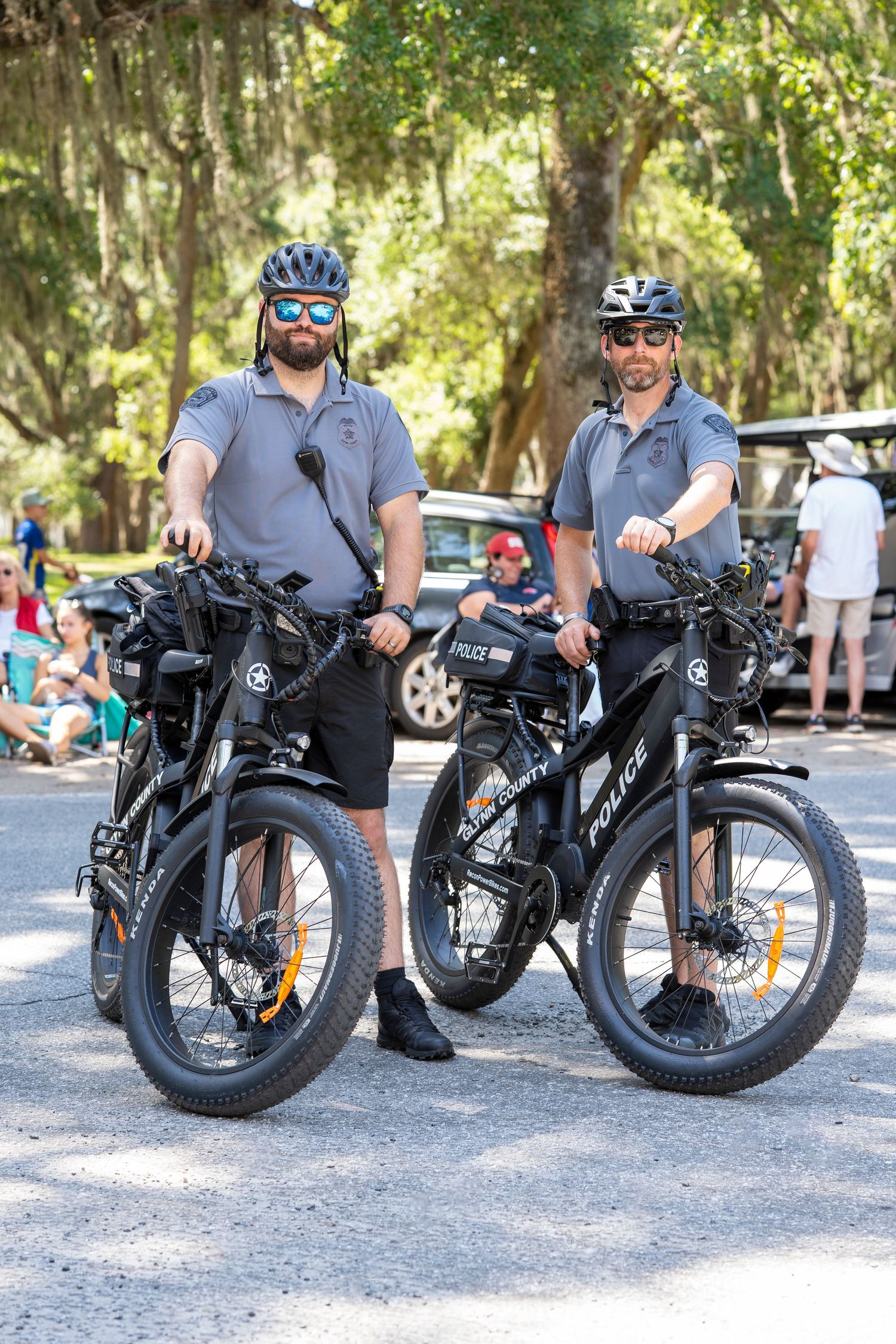 A sequence of photos showing a rugged black electric fat tire bicycle parked on gravel from different angles outdoors.