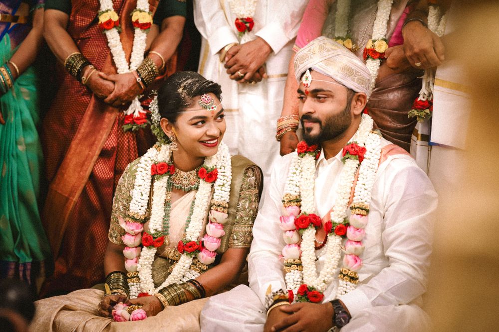 Traditional Indian wedding ceremony with decorative floral garlands and cultural attire.