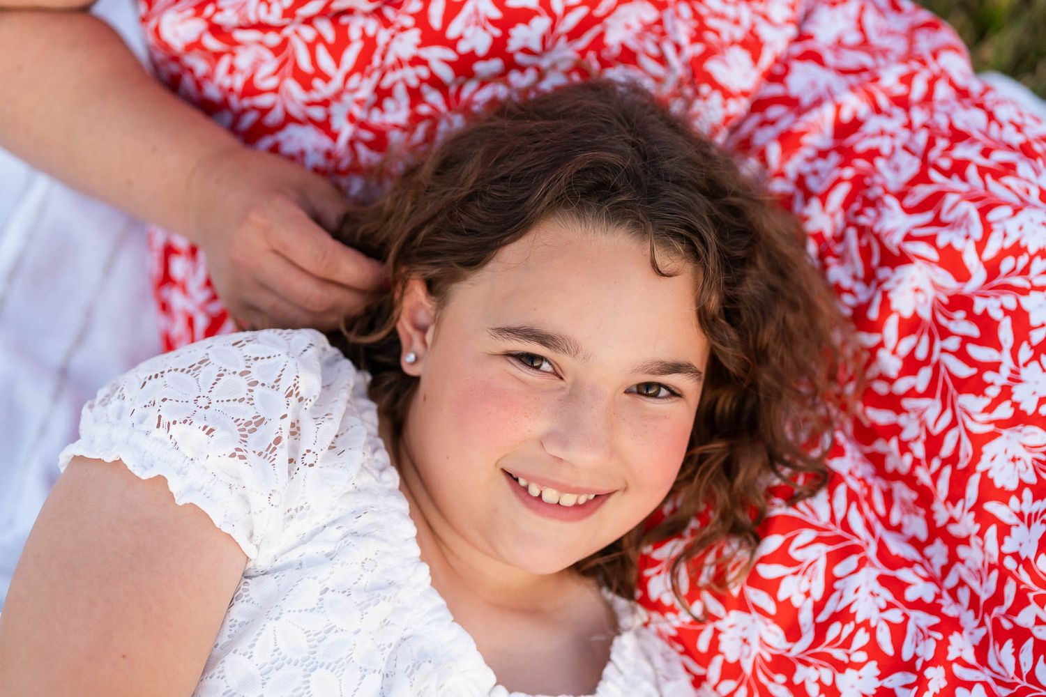 Mother strokes daughters hair at sunset in Redmond
