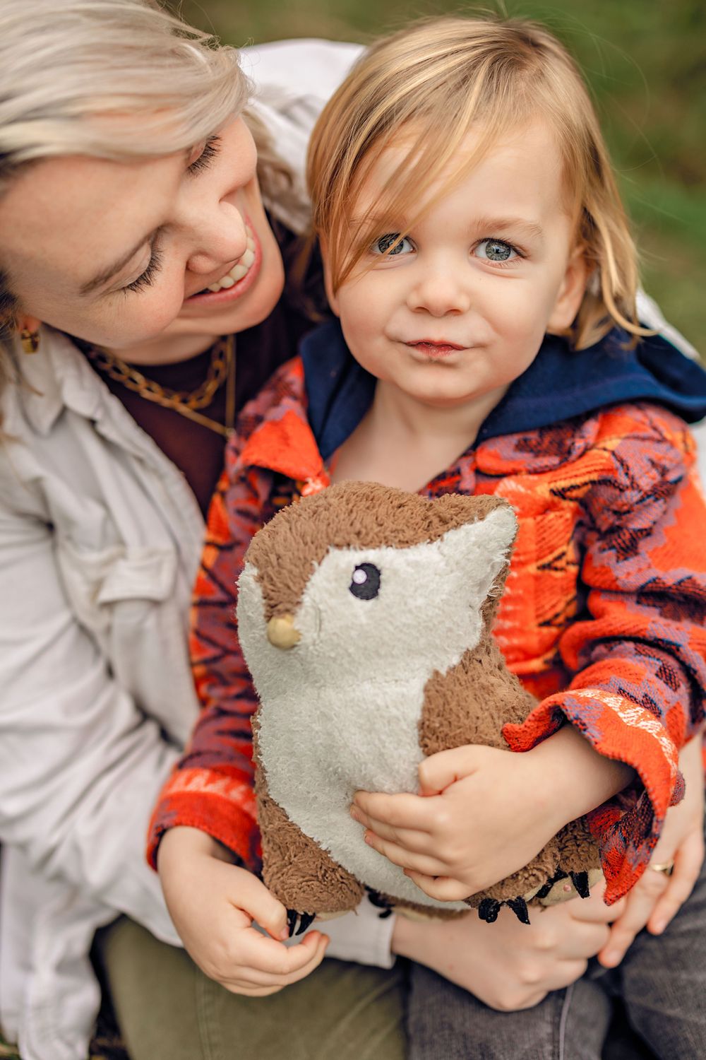 A series of candid moments showing a child hugging and snuggling with a plush teddy bear while wearing an orange shirt.