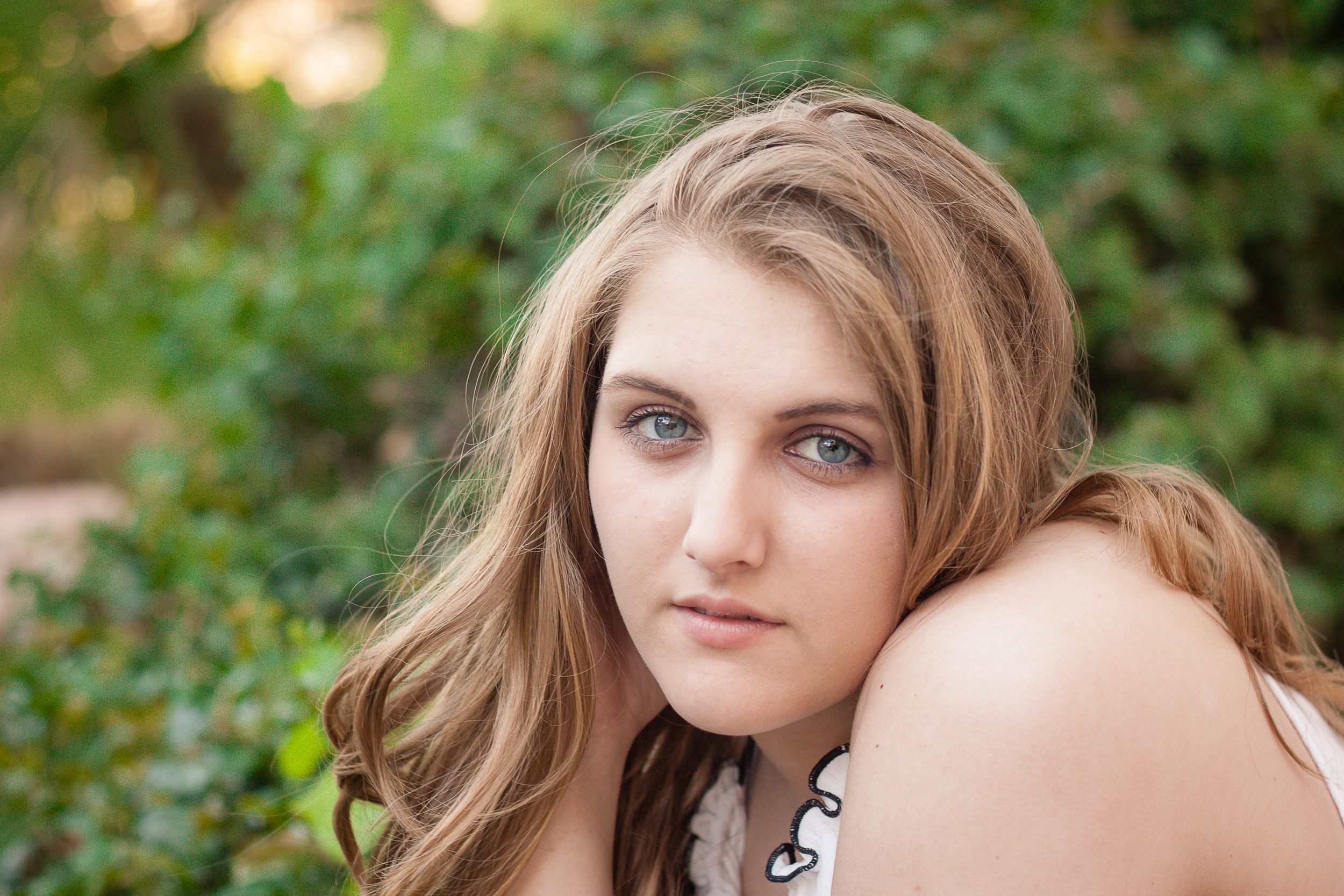 A series of portrait photographs taken outdoors with natural green foliage in the background.