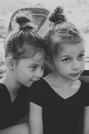Black and white photos showing pensive expressions and poses at ballet class.