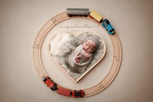 Newborn composite with little wooden cars on a heart track. - Greenville SC newborn photographer - Easley SC newborn photographer