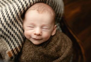 A newborn boy smiling. Greenville SC newborn photographer. - Easley Sc newborn photographer. Greenville SC photos