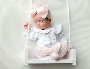 Newborn girl on a swing in pink. Greenville SC newborn photographer. - Easley Sc newborn photographer. Greenville SC photos