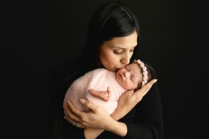 Mom and newborn girl connection. Mom kissing baby. Greenville SC newborn photographer. - Easley Sc newborn photographer. Greenville SC photo