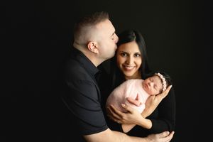A sweet connection between mom, dad, and newborn baby girl. Greenville SC newborn photographer. - Easley Sc newborn photographer. Greenville