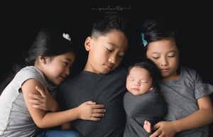 Sweet siblings snuggling their newborn brother. Greenville SC newborn photographer. - Easley Sc newborn photographer. Greenville SC photos