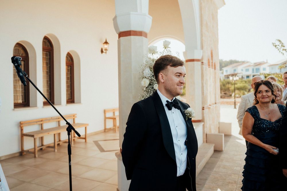 A series of wedding photos showing candid moments in a bright white venue with elegant decor and formal attire.