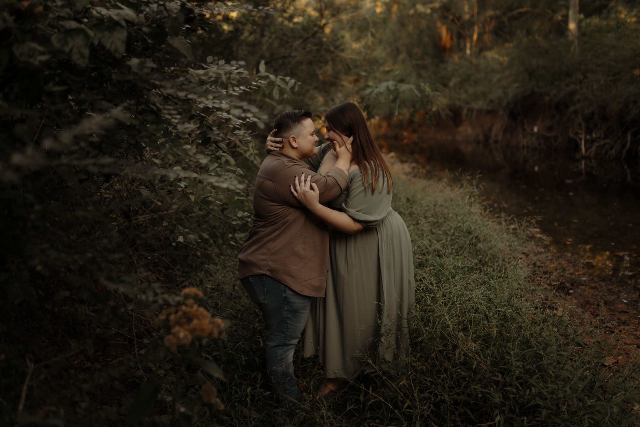 A romantic autumn forest scene with warm moody lighting and fallen leaves.