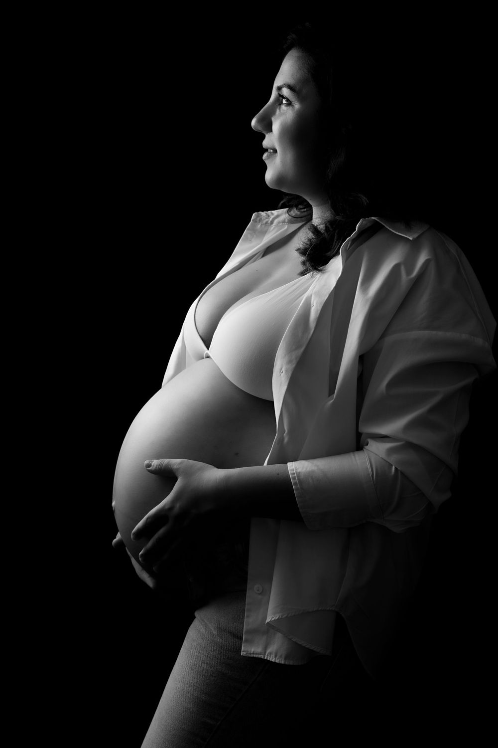 Softly backlit baby bump