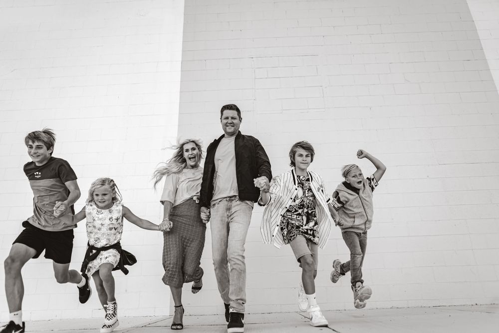 Family photo session running fun candid. At Wind and James in Three Rivers