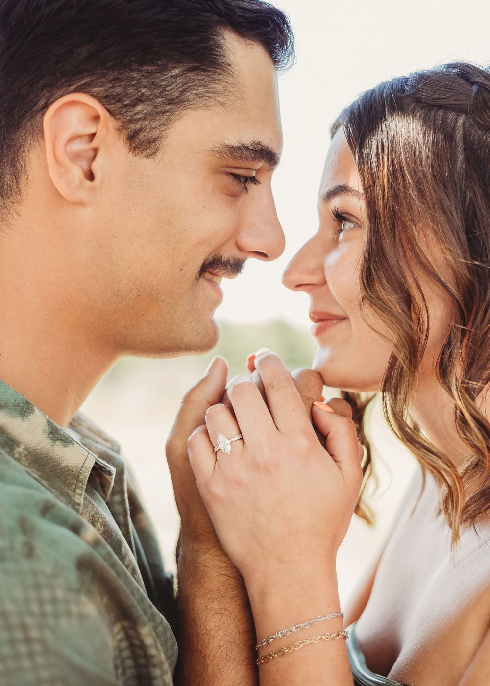 Engagement shoot of a couple looking into each other's eyes