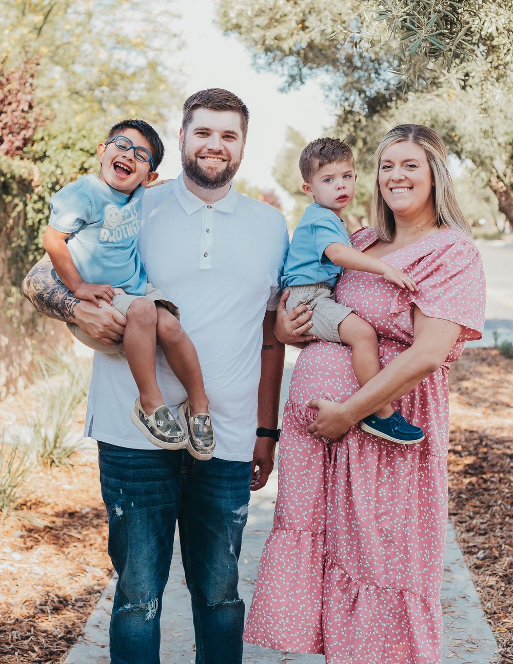 Family shoot of parents holding their two children