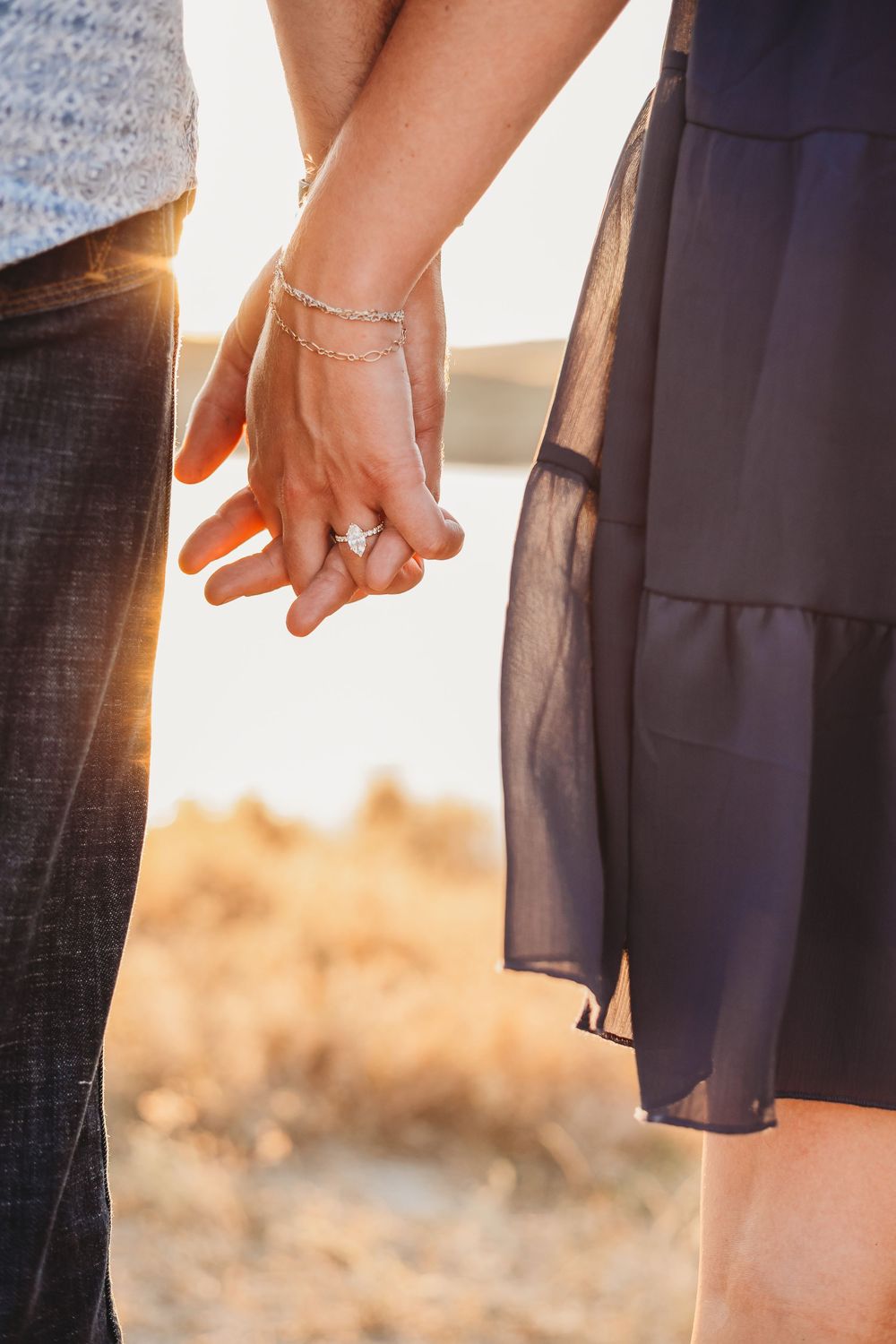 Engagement shoot with a couple holding hands
