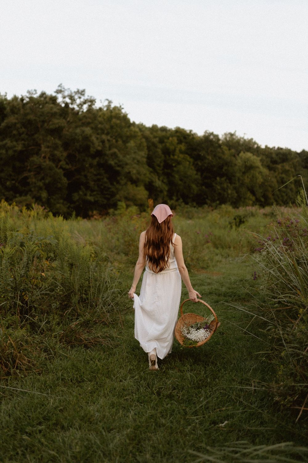 a red-headed woman walking away