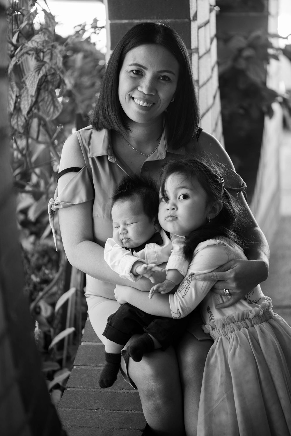 Photo of Phillipino woman with her young daughter and new baby boy - Kelly Chapman Photographer Perth