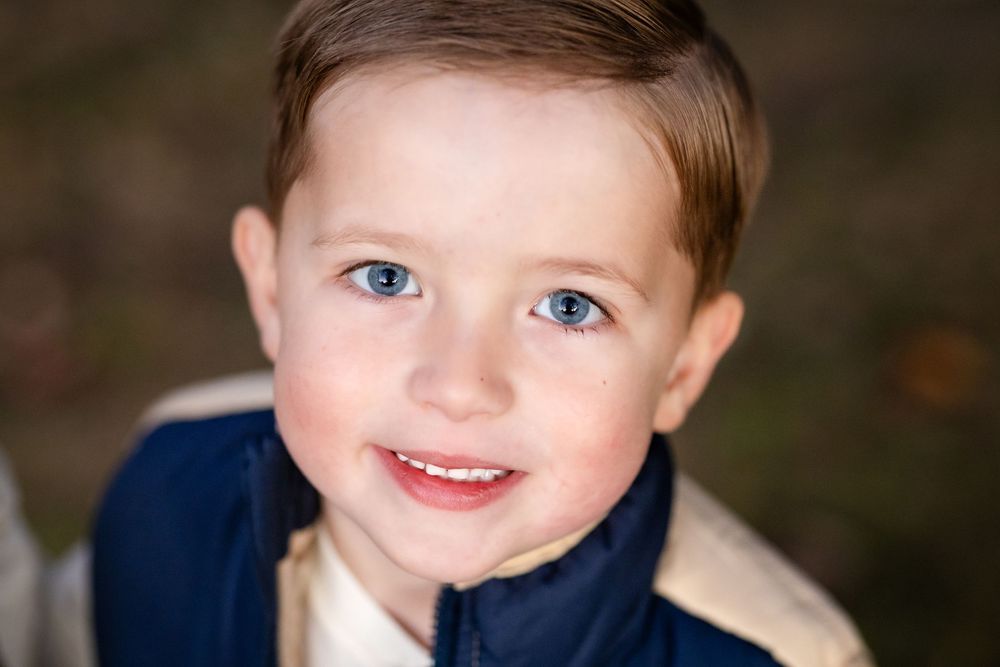 Smiling young boy during a family session in the Twin Lakes area of Arkansas