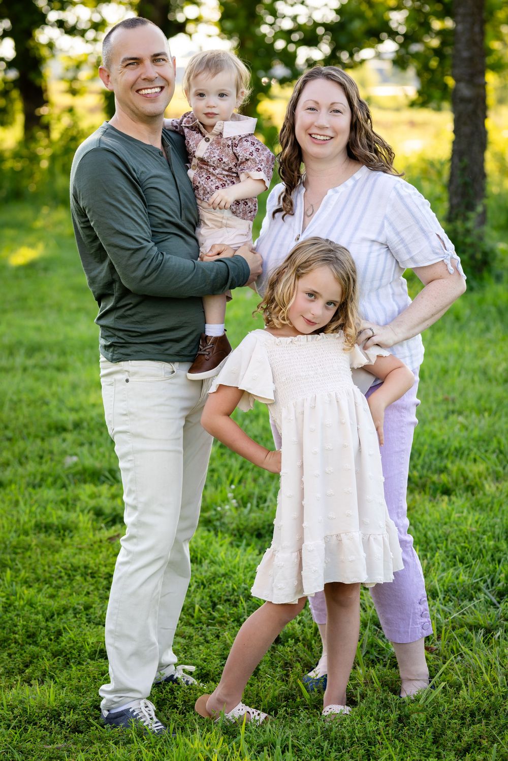 Family of four during a family reunion session at a park in Mountain Home, Arkansas